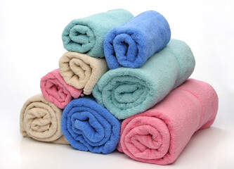 Group of towels like a pyramid. Soft colors over white background