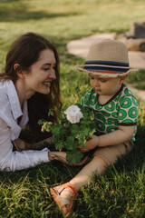 Summer day for a young family, mom and little son became joyful and happy. Happy family concept...