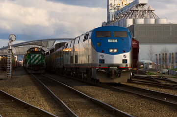 Fototapeta na wymiar P-40 Diesel Locomotive passing a Freight Train in a rail yard