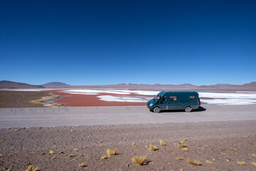 Fototapeta na wymiar A 4x4 camper next to Laguna Colorada in the Bolivian Andes