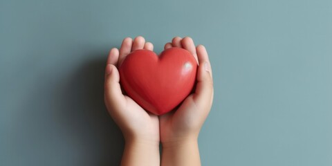 Fototapeta premium Child hands holding red heart,health care, donate and family insurance concept,world heart day, world health day, CSR responsibility, adoption foster family, hope, gratitude, kind, generative ai