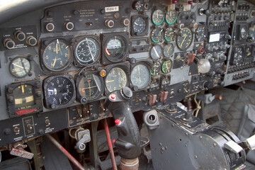 The various switches and dials of a aircraft cockpit.