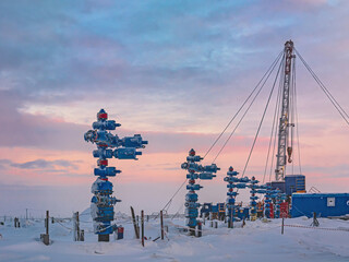 The Northern gas field. In the foreground is a row of gas producing wells. In the background, a...