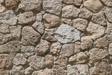 old wild stone wall without mortar	
