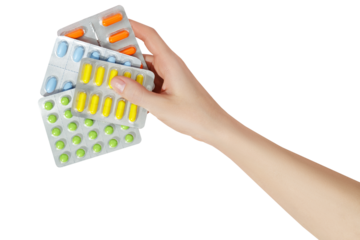Multicolor pills tablets in the woman hand on transparent background. Medicine concept