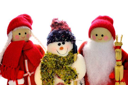Wooden Father and Mother Christmas dolls with a snowman, on a white background. Space for text.