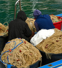 A colorful view of fishing nets and bowies.
