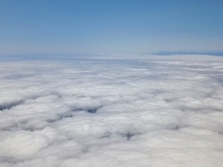 above the clouds, airplane view
