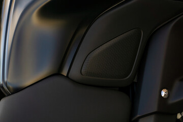 Detail of the tank of a black motorcycle close up