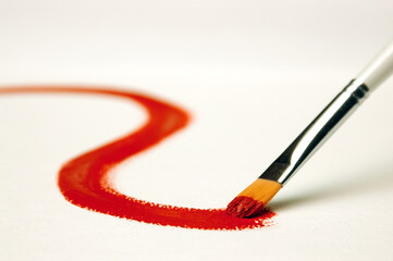 Red paint on white canvas
