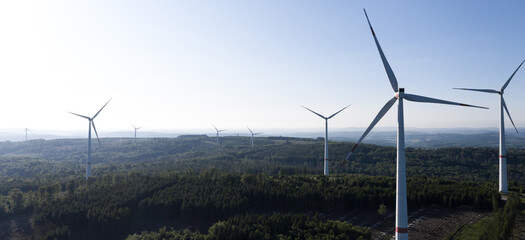 a modern wind park from above in dusk panorama