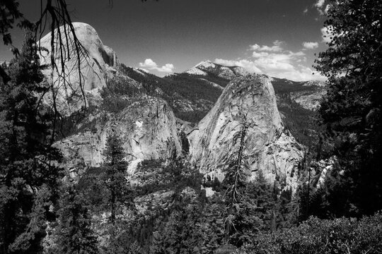 Black and white image from color original. Left to right south side of Half Dome, Mount Broderick, Liberty Cap. View from above Nevada Falls, in Yosemite National Park, California, USA.