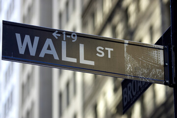 Wall street sign corner of broadway, the brown colour indicates the historic area, manhattan, new...