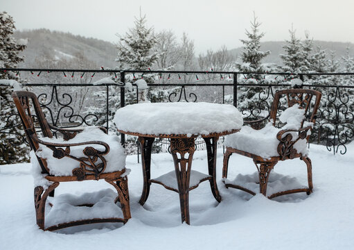 Table and chairs on a winter terrace