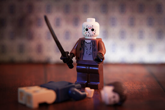 NEW YORK USA, AUG 31 2019: Horror film Friday the 13th killer Jason Voorhees Lego style minifig with machete and headless victim at Camp Crystal Lake