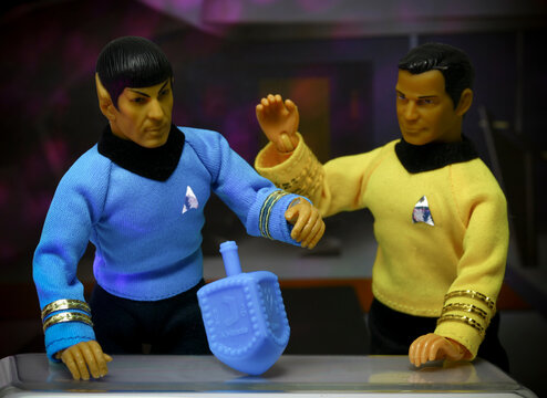NEW YORK USA, DEC 19 2018: Star Trek Captain Kirk and Mr. Spock celebrating Chanukah - spin the dreidel - Mego action figures
