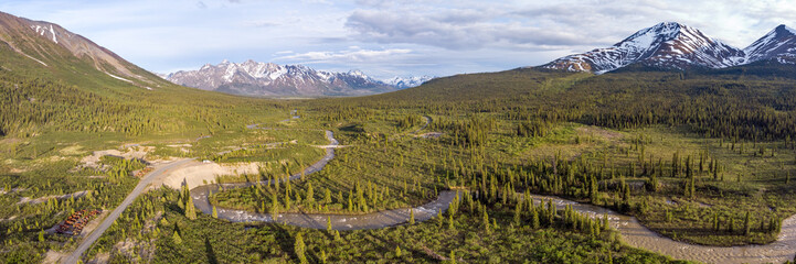 Panoramic scenic area in wilderness of Yukon Territory, Canada during summer time with boreal...