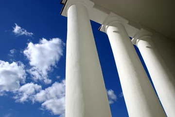 Deurstickers White columns in blue background of sky © Designpics