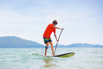 Man on stand up paddle. Water and beach sport