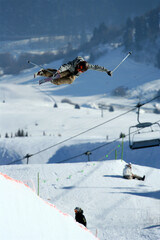 Fototapeta na wymiar A skier riding a halfpipe.