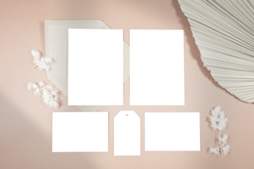 Wedding stationery suite cards styled with minimalist boho decor and on-trend shadow photography. Two 5x7 invitations, two half cards, and gift favor tags mockup.