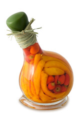various peppers in a glass bottle