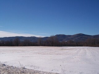 fields with mountain range
