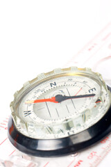 Compass with focus on the north over a white background. Small DOF