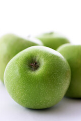 Green apples on white background