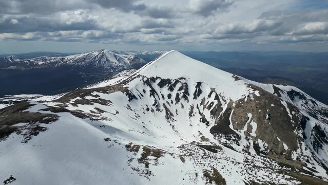 A drone footage of mountains Hoverla and Petros on a background. aerial view from above of Carpathian mountains