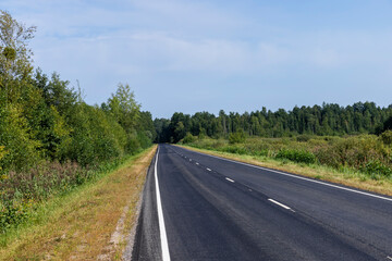 Fototapeta na wymiar Narrow paved road for cars