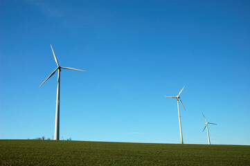 Fototapeta premium Three Windturbines and blue Sky