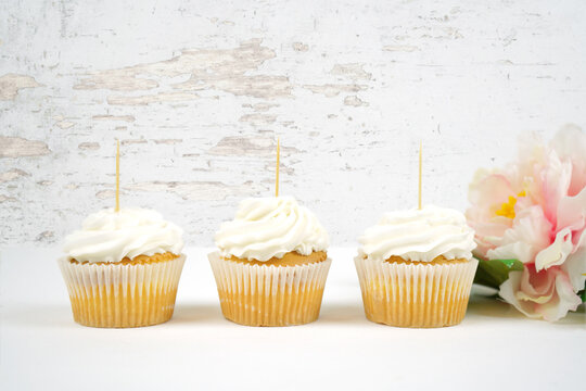 Three vanilla cupcake toppers mockup. Romantic shabby chic, modern farmhouse styling. Negative copy space.