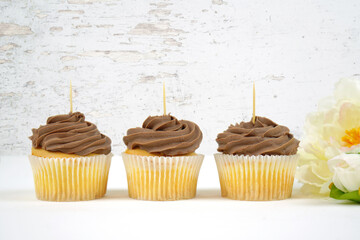 Three chocolate cupcake toppers mockup. Romantic shabby chic, modern farmhouse styling. Negative copy space.