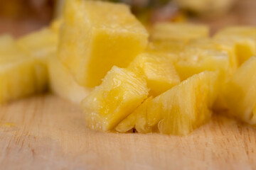 Sliced into pieces of fresh ripe peeled pineapple