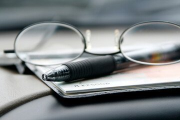 Close up on the Glasses and the Checkbook