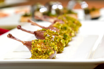 Pistachio crusted quail ballotine served with sweet potato and goat cheese mousse