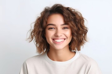 Portrait of beautiful young woman with curly hair on white background.