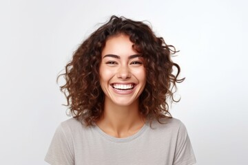 Portrait of a happy young woman with curly hair over white background