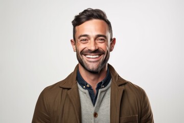 Obraz premium Portrait of a handsome man smiling at camera isolated on a white background