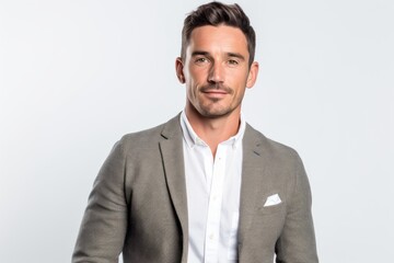 Portrait of a handsome man in a gray suit on a white background