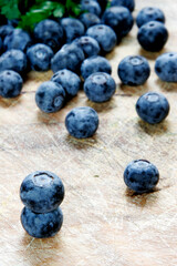 Fresh blueberries on rustic wooden background