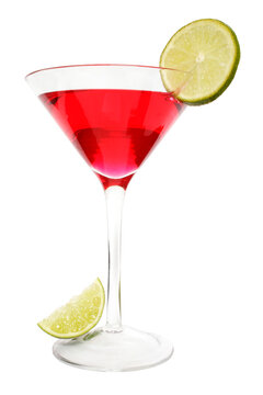 Isolated red cocktail with lime slice garnish and lime wedge