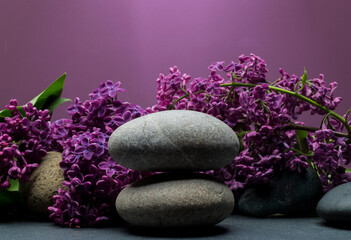 Obraz na płótnie Canvas zen stones and flowers for product presentation.spa composition with stones and flowers for podium banner background