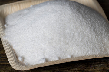 White sugar poured into a bowl