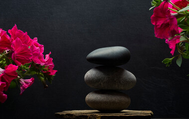 Fototapeta na wymiar zen stones and flowers for product presentation.spa composition with stones and flowers for podium banner background