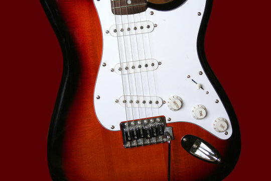 Close up electric guitar stratocaster pickups strings.