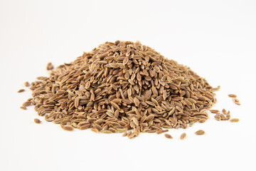 dill seeds , isolated on white. Shallow depth of field, focused on the centre of the pile.