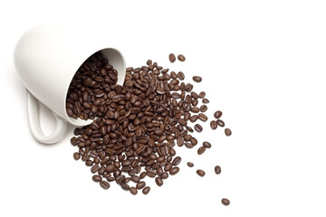 spill the beans - white coffee cup with spilt whole coffee beans, a high-key closeup isolated on...
