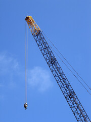 Naklejka premium Crane against a blue sky